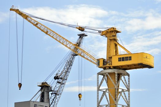 Two cranes in a dockyard