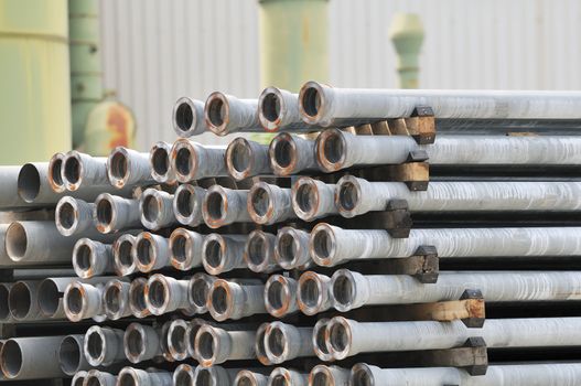 Piled pipes stored out of a factory