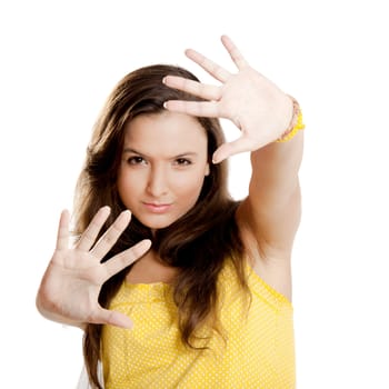 Beautiful young girl with both hands on the air, isolated on white