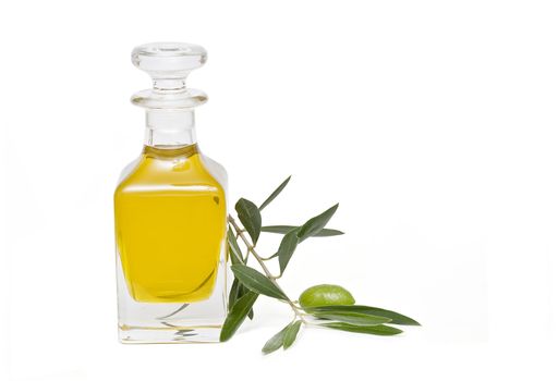 Olive oil bottle witn olives and olive branches isolated on white background.