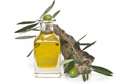 Olive oil bottle witn olives and olive branches isolated on white background.