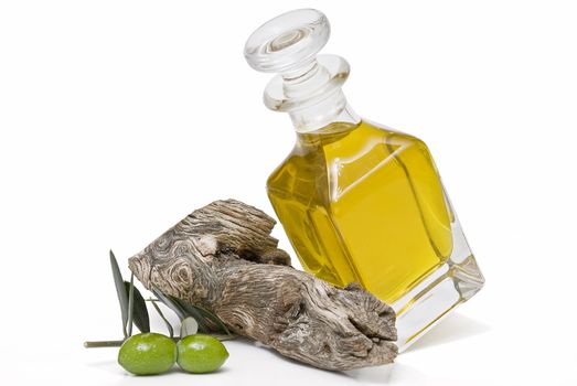 Olive oil bottle witn olives and olive branches isolated on white background.