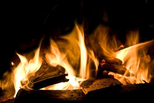 Flames of Fire in a Fireplace against a black Background 