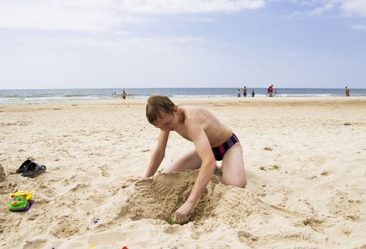 Young teenager playing on the beach