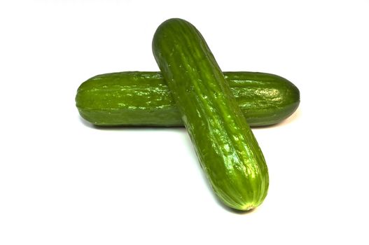 Fresh high resolution photo of two isolated cucumbers.
