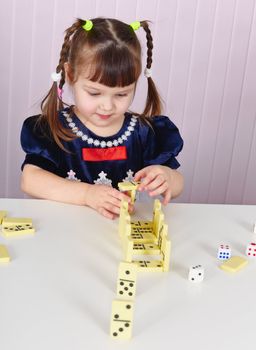 A child plays with toys at the table