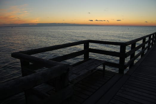 pier going out into the Baltic Sea at dusk