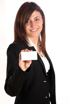 Young woman smiling, holding a business card unmarked. The business card is seen in the foreground of the picture, the woman is blurred in the background .- With space for text