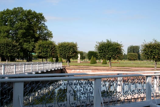 Sunny summer day in the well-groomed park
