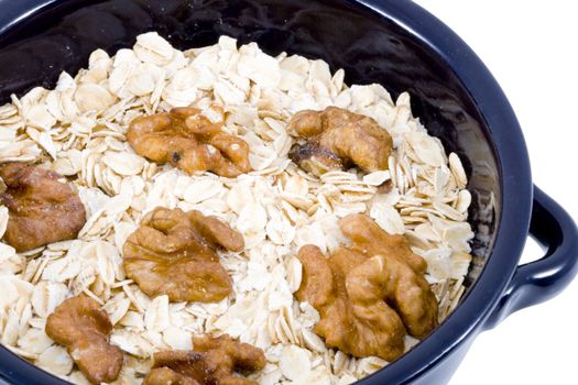 a bowl of oatmeal with walnuts - healthy diet