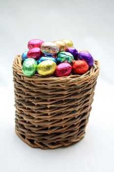 A wicker basket with chocolate easter eggs