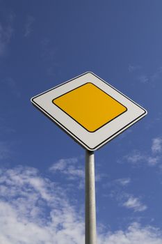 Traffic signs - the main road on blue sky background
