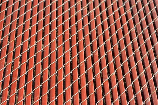 Background of red fence with lines and blurred edges