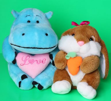 Soft toys hippo with pink heart and hare with carrot