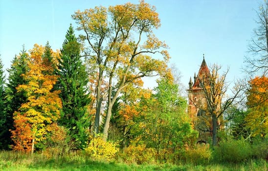 Ruined tower with autumn trees around