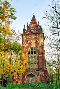 Ruined tower in autumn park