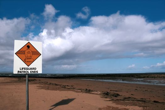 a sign warning that there is no lifeguard patrol beyond this sign