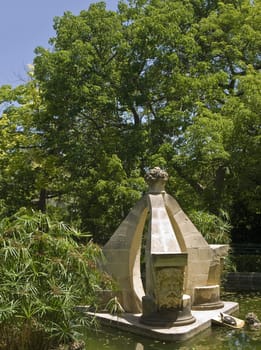 Limestone fountain in a garden   