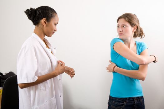 Patient pointing out to the doctor where she is hurting