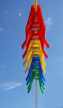 Pegs on washing clothes laundry line, blue sky