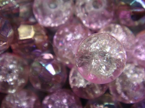 A close up photo of pretty pink and clear glass beads.