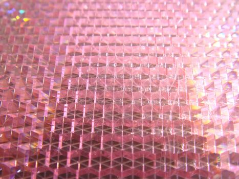 Pink honeycomb up close from a safety reflector.