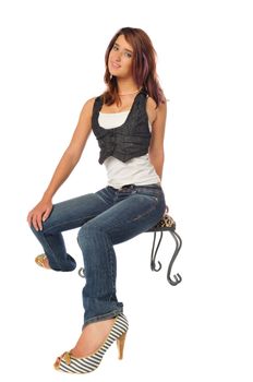 attractive young woman on a stool set on a white background