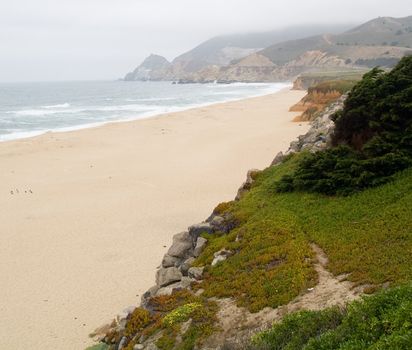 Beach cliffs on a cold, foggy morning.