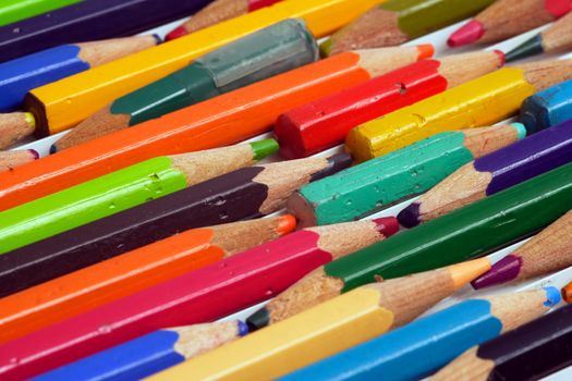 Macro image of used colouring pencils. Focus is in the middle.
