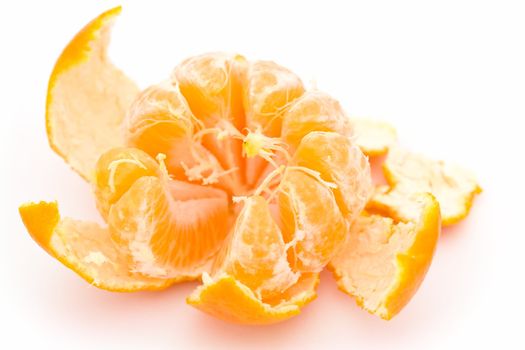 One juicy tangerine on a white background