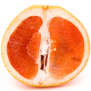 The cut grapefruit on a white background