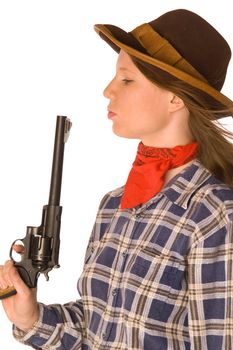 Cowgirl blowing to her gun after shoot (isolated on white)