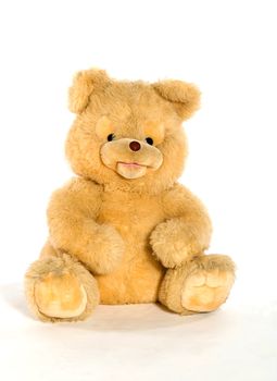 Yellow teddy bear isolated on white