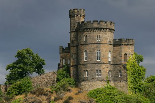 Castle on a hill in Scotland.  Shot on an overcast day just as the sun came out behind me and illuminated the castle.
