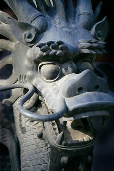 Closeup of the dragon in the Imperial Palace in Beijing, China. (short depth of field, focusing on the eye)
