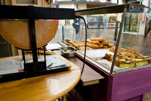 Street buffet with Raclette cheese grill at town of Annecy in the Haute-Savoie departement of France