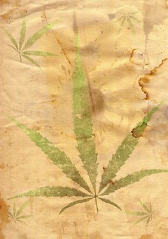 Old grunge paper with leaf of grass in grunge style