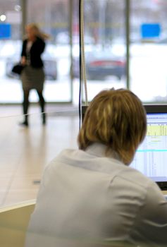 help-desk manager cubicle, selective focus on monitor