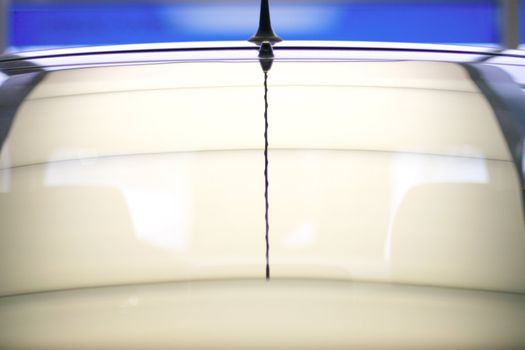 backside windshield with selective focus on radio antenna