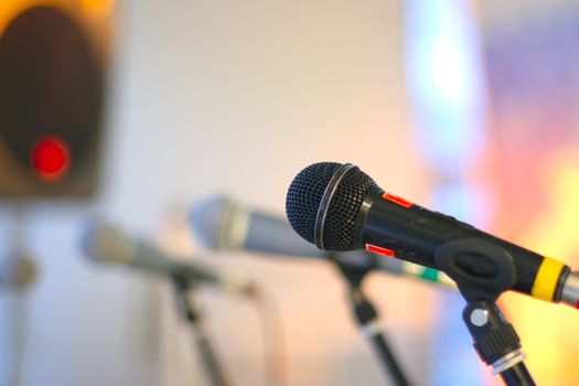 close-up microphone on the stage against colorful background