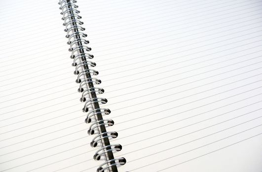 Close-up image of white lined notepad.