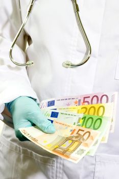 Doctor in detail with euro banknotes