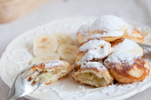 Danish specialty which are small pancakes filled with banana