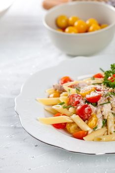 Delicious and fresh pasta with tomatoes, chives and parmezan