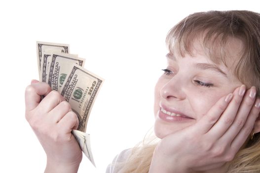 Beautiful young woman holding a stack of money isolated over white