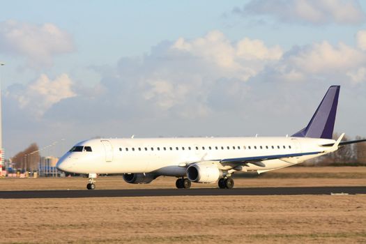 A commercial airplane on the runway, preparing for take off