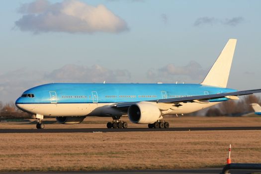 A commercial airplane on the runway, preparing for take off