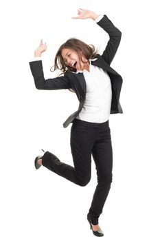 Ecstatic businesswoman in suit dancing. Excited happy asian business woman isolated in full length on white background. Mixed caucasian / chinese model.