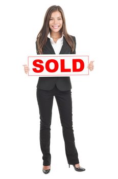 Real estate agent holding sold sign. Isolated in full length on white background. Mixed caucasian / chinese model.