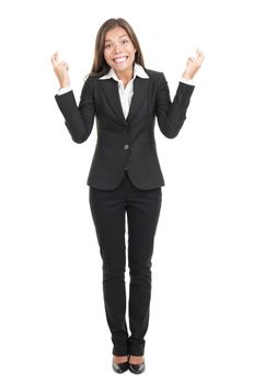 Businesswoman crossing fingers hoping for the best. Attractive mixed race chinese / caucasian woman isolated on white background in full length.